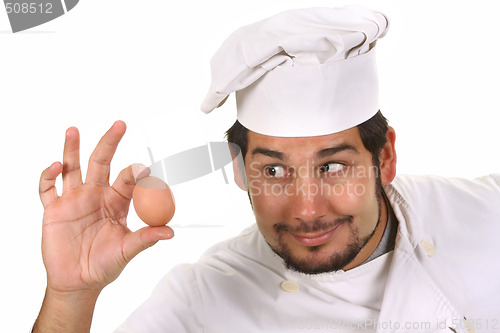 Image of young funny chef with egg