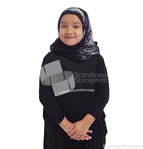 Image of Islamic fashion, young girl and smile standing in white background for culture happiness, religion awareness or empowerment. Muslim child, happy and religious clothes or hijab isolated in studio