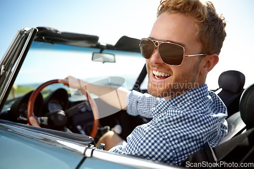 Image of Car road trip, travel and portrait man on holiday adventure, happy transportation journey or fun summer vacation. Flare, sunglasses and driver driving convertible vehicle on Canada countryside tour