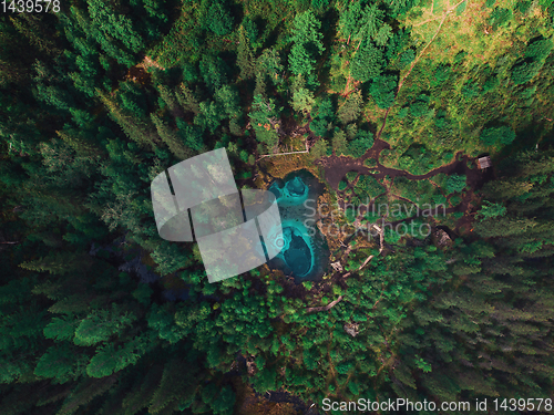 Image of Geyser (blue, silver) lake with thermal springs