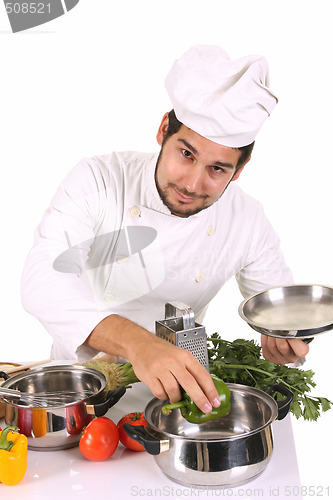 Image of young chef preparing lunch