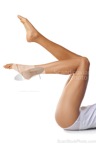 Image of Legs, beauty and skincare with a model black woman in studio isolated on a white background with mockup. Spa, feet and skin with a female posing in underwear for natural treatment or hair removal