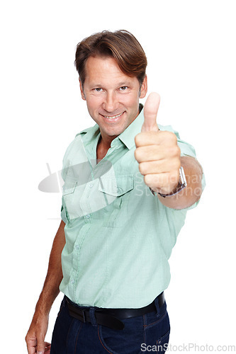 Image of Man, studio portrait and thumbs up with smile, casual fashion and yes by white background with happiness. Happy middle aged man, hand sign and agreement with success, isolated or confident with shirt