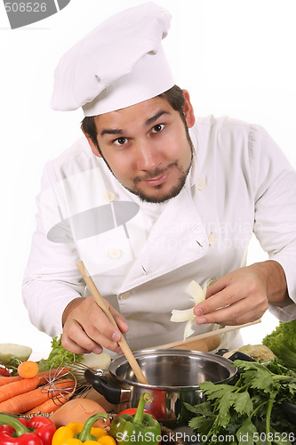 Image of young chef preparing lunch