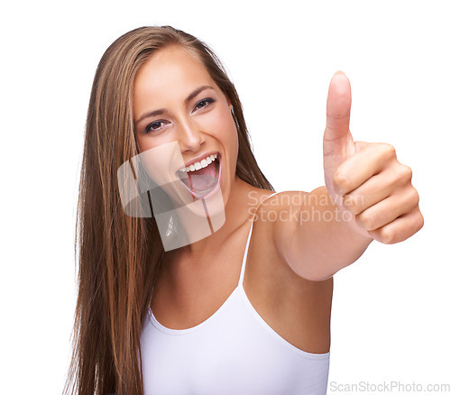 Image of Thumbs up, winner and portrait of a woman with yes isolated on a studio background. Success, smile and model with a hand emoji sign for agreement, win and goal on a white background in studio