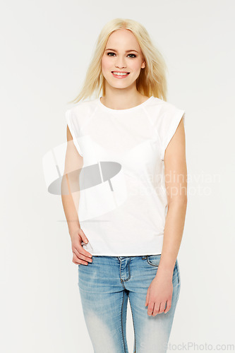 Image of Fashion, smile and portrait of a model in studio with a cosmetic, makeup or natural face routine. Beauty, cosmetics and young woman from Australia with a casual outfit or clothes by white background.