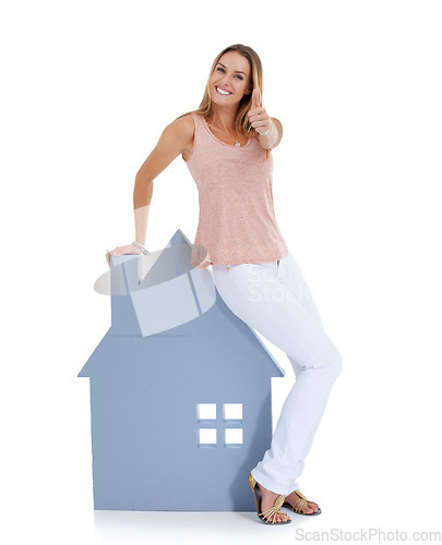 Image of Woman, thumbs up and home board portrait for real estate, property investment and house vision in studio. Realtor winner, home loan approval and and property management agreement in white background