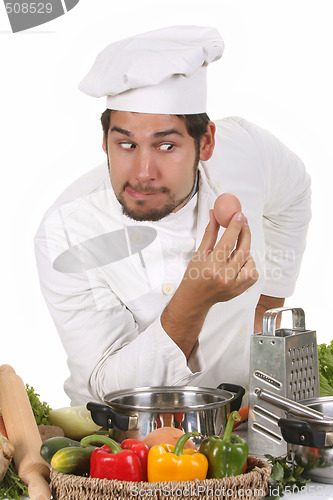 Image of young funny chef and egg