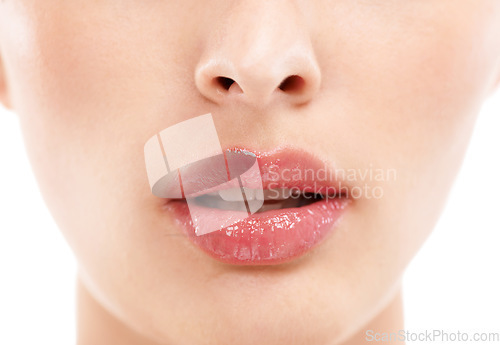 Image of Woman face, skincare or lips with makeup cosmetics, mouth dermatology or healthcare wellness on white background. Zoom, beauty model and macro of facial lip gloss product for collagen hydration glow