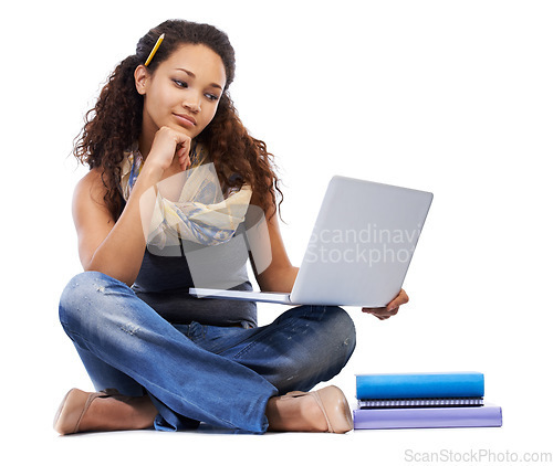 Image of Student, laptop and studying with books or thinking in studio for university education, knowledge and internet research. Young black woman, learning or reading college online notes on tech device