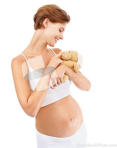 Image of Pregnant woman, teddy bear and happy pregnancy stomach with a mother excited about motherhood. Child toy, mothers love and mama happiness with a mom smile looking at rabbit doll for children