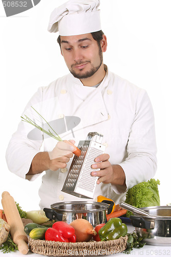 Image of young chef preparing lunch 