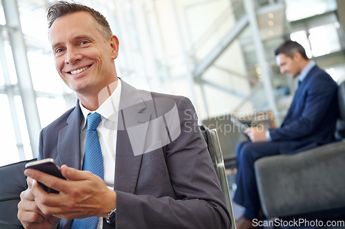 Image of Smile, corporate or businessman with phone for invest strategy, finance growth or financial blog news. Travel, happy or CEO in airport lobby for social media, networking or internet website review