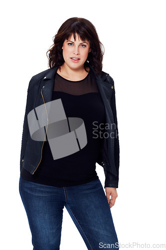 Image of Portrait, fashion and attitude with a woman in studio on a white background looking confident. Serious, style and confidence with a young female model posing in contemporary clothes or clothing