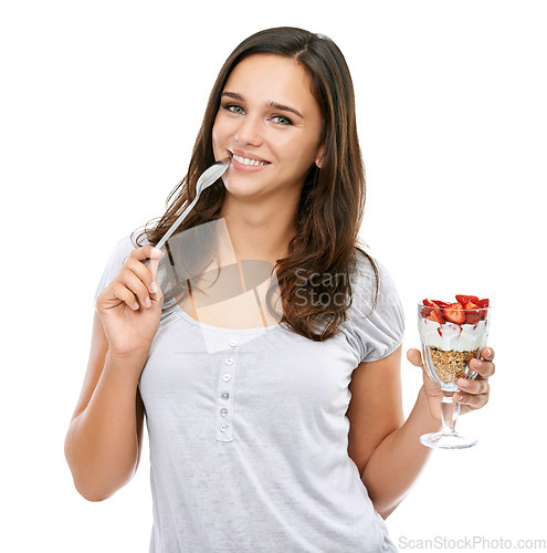 Image of Woman, portrait and eating dessert food in studio with strawberry fruit and yogurt for breakfast or healthy snack. Face of a female model isolated on a white background for nutrion, diet and wellness