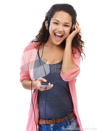 Image of Portrait, music headphones and woman with phone in studio isolated on a white background. Cellphone, face and happy female with wooden headset streaming, listening or enjoying podcast, radio or audio