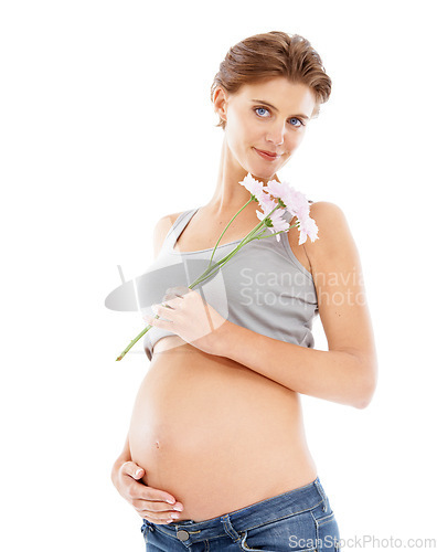 Image of Flowers, pregnant woman and studio portrait for pregnancy skincare, cellulite and beauty cosmetics. Healthcare, wellness and mother hand on stomach with floral or natural product advertising