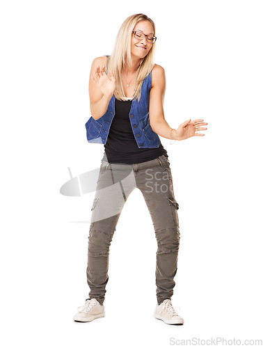 Image of Dance, playful and woman moving with a smile, excited and happy on a white background in studio. Comic, funny and hip hop dancer dancing with movement, confidence and happiness on a studio background