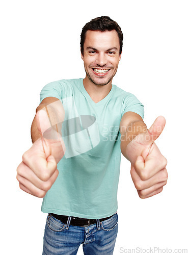 Image of Portrait, thumbs up and motivation with a man in studio isolated on a white background showing an emoji as a winner. Thank you, goal or target with an excited man giving a positive hand sign