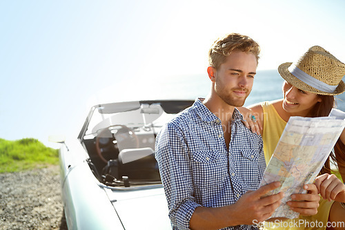 Image of Road trip, adventure and couple with map by car on summer holiday, vacation and weekend getaway by ocean. Travelling, freedom and man and woman reading paper for directions, navigation and journey