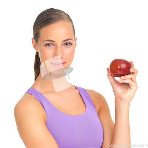 Image of Healthy, fruit and portrait of a woman with an apple for health on a white background in a studio. Food, smile and fitness trainer with fruits for vegan diet and lifestyle on a studio background