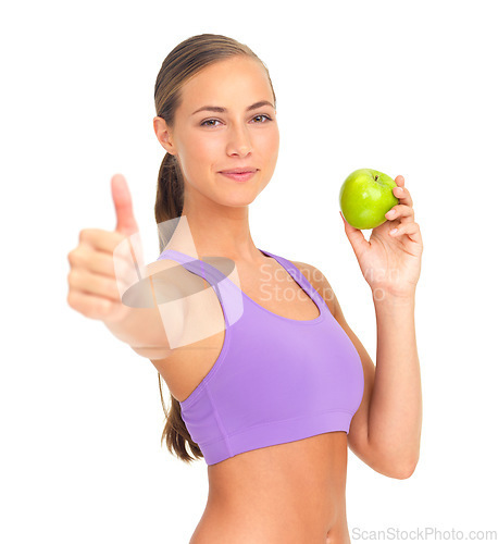 Image of Woman, apple and studio portrait with thumbs up for nutrition, diet goal or wellness by white background. Isolated model, healthy fruit or smile for health, vitamin c or natural detox for strong body