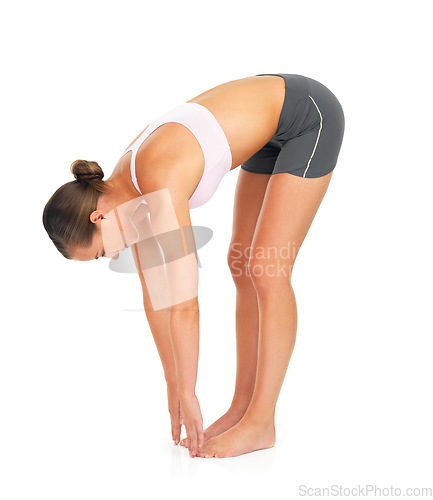 Image of Fitness, exercise and woman stretching in a studio for wellness, healthy training and wellbeing. Sports, health and slim female model doing a warm up workout while isolated by a white background.