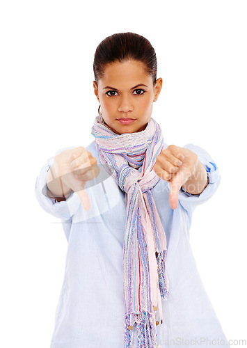 Image of Portrait, thumbs down and emoji with a black woman in studio isolated on a white background to disagree. No, rejection and deny with a young female showing a negative hand sign on blank space