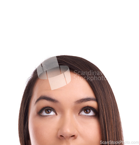 Image of Half face of a woman looking at mockup space in a studio for product placement or marketing. Beauty, young and female model a with empty mock up for advertising isolated by a white background.