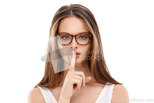 Image of Secret, portrait and woman with glasses, lips and finger in studio, isolated white background and privacy. Face, female model and silence gesture on mouth for quiet, shush hands and gossip to whisper