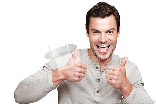 Image of Portrait, thumbs up and winner with a man in studio isolated on a white background showing an emoji for motivation. Thank you, goal or target with a positive man giving a hand sign of support