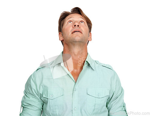 Image of Idea, mature and man looking up in a studio with uncertainty, wonder and contemplation. Thinking, pensive and handsome male model daydreaming in a casual outfit while isolated by a white background.