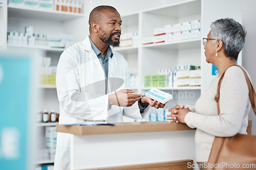 Image of Healthcare, pharmacist and woman at counter with medicine or prescription drugs purchase at drug store. Health, wellness and medical insurance, black man and customer at pharmacy for advice and pills