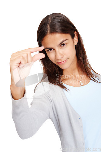 Image of Woman, portrait and fingers for advertising size, space and small mockup with a smile in studio. Female model in studio showing hand or sign for scale, inch or symbol isolated on a white background