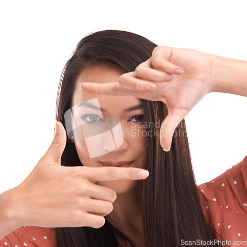 Image of Portrait of a woman with a finger picture frame in a studio for creative vision for photography. Beauty, face and young female model from Asia with a fake hand camera isolated by a white background.