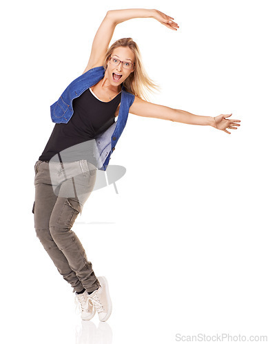 Image of Woman dancer, studio portrait and fashion with smile, glasses and comic happiness by white background with style. Confident model, isolated and funny dancing with trendy jeans, sneakers and clothes