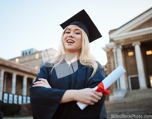 Image of Portrait, graduation and success with a student woman holding a diploma or certificate outdoor as a graduate. Study, goal or unviersity with a female pupil standing outside after scholarship study