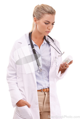 Image of Woman pharmacist reading medicine table on a white background with focus for pharmaceutical healthcare. Doctor hand holding pills or container thinking of drugs risk or medical brand in studio