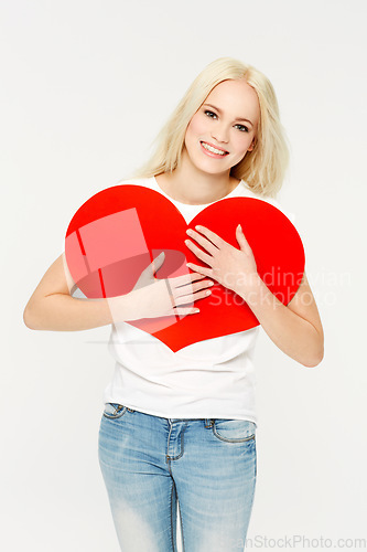 Image of Heart, sign and portrait of woman in studio for love, paper and emoji against a white background. Face, shape and girl showing care, affection and self love, happy and content, young and beautiful