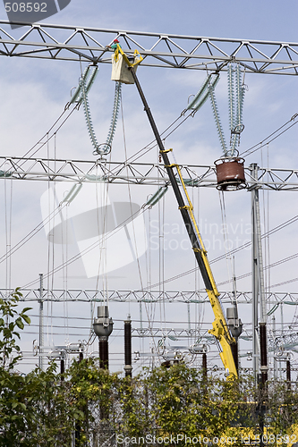 Image of repairing high voltage power lines