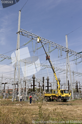 Image of repairing high voltage power lines