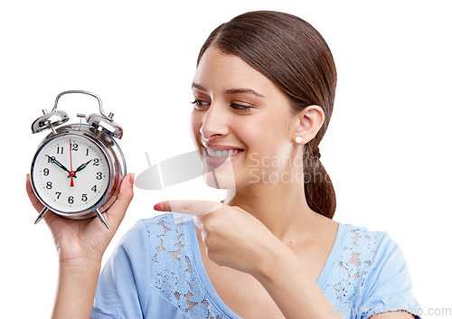 Image of Clock, time and pointing with a model woman in studio isolated on a white background for alarm or reminder. Alarm clock, point and schedule with a young female on blank space for a deadline