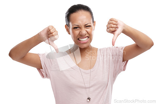Image of Woman, thumbs down and unhappy expression for disagreement, wrong or fail against a white studio background. Portrait of isolated female model showing down thumbs in disapproval, no or failure