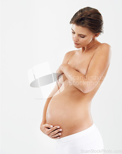 Image of Pregnant, woman and bare with health, wellness and nurture with lady isolated on white studio background. Female, pregnancy and mother with care, growth and healthy maternity with body care and relax