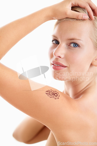 Image of Beauty, portrait and woman with tattoo in studio for wellness against a white background space. Face, model and girl relax after skin, facial or dermatology care, routine and skincare while isolated