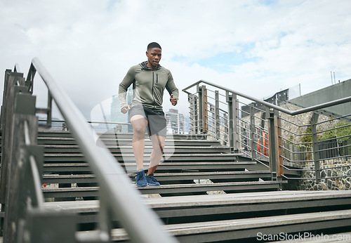 Image of Fitness, bridge or black man running on stairs for legs training, exercise or workout in city of in Miami, Florida. Steps, runner or healthy sports athlete with wellness goals, motivation or mission