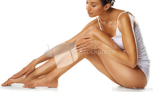 Image of Woman, legs and skincare for beauty, studio and isolated on white background. Female model, laser hair removal and leg cosmetics for body, wellness and epilation of aesthetic results, shine and salon