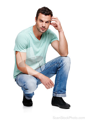 Image of Fashion, attitude and portrait of man on a white background in trendy, casual and stylish clothes. Confidence, handsome and isolated male fashion model kneel in studio in urban, retro and 2000s style