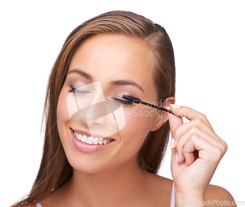 Image of Mascara, lashes and woman with makeup and beauty, microblading with eyelash brush isolated on white background. Portrait, smile and eyes, cosmetic care and cosmetics tools with skincare closeup