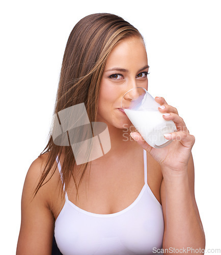 Image of Milk, glass and portrait of woman with white background, isolated studio and healthy diet. Face of female model, dairy product and organic breakfast with protein, calcium and vitamins for wellness